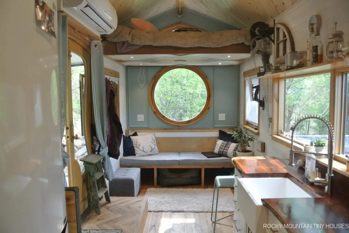 The San Juan Tiny House features a manually-elevated bed, seen here in the raised position
