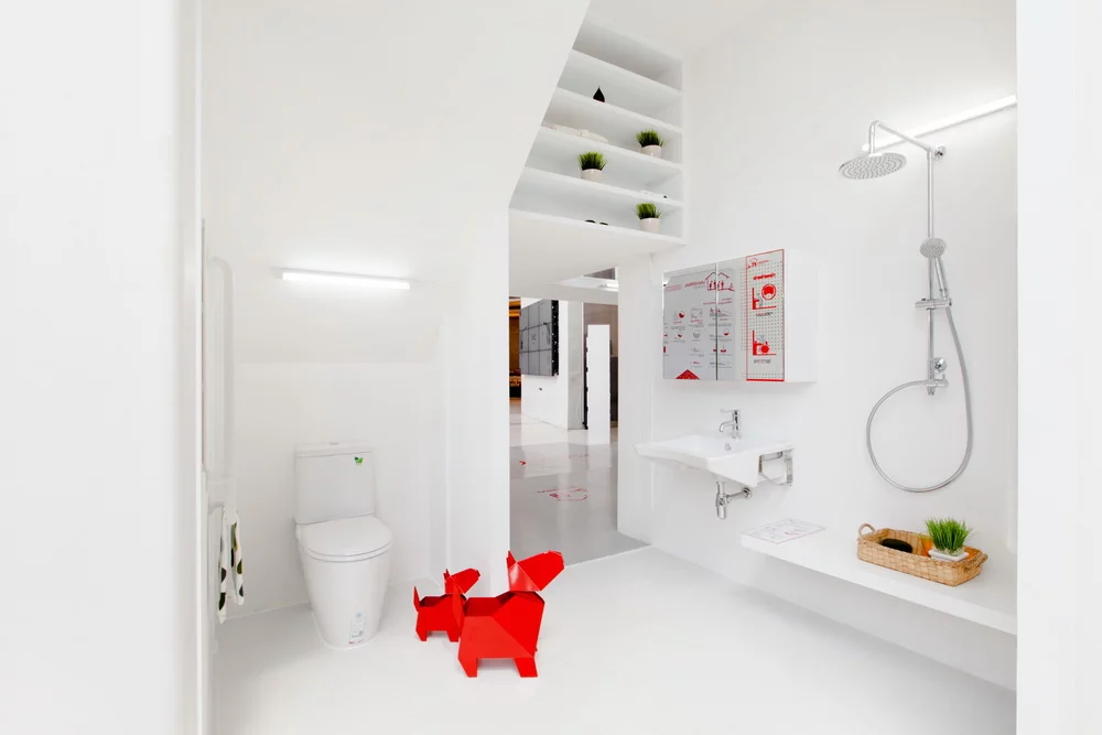 The Living in the City bathroom contains a shower, sink, and toilet