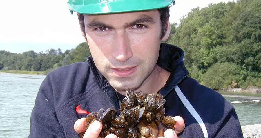 Prof. David Aldridge, with a handful of zebra mussels