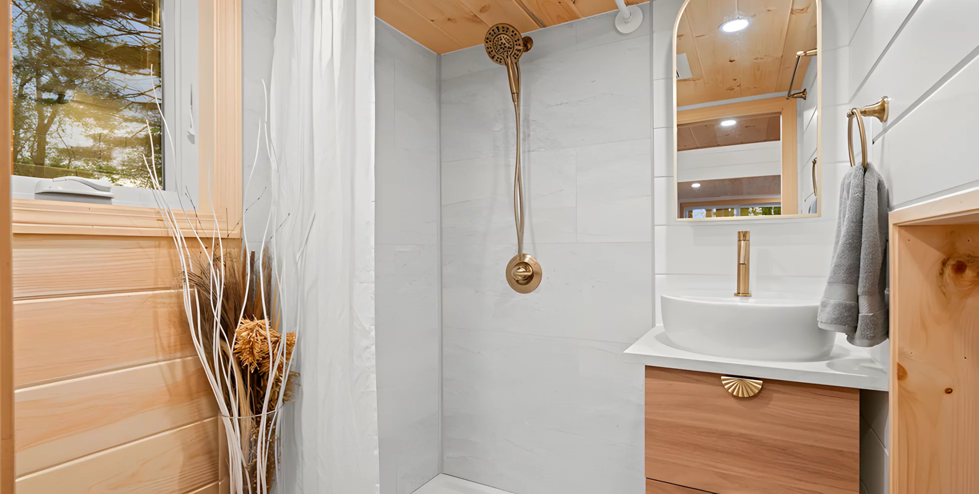 The Honey Bee's bathroom includes a shower, sink, and a composting toilet as standard