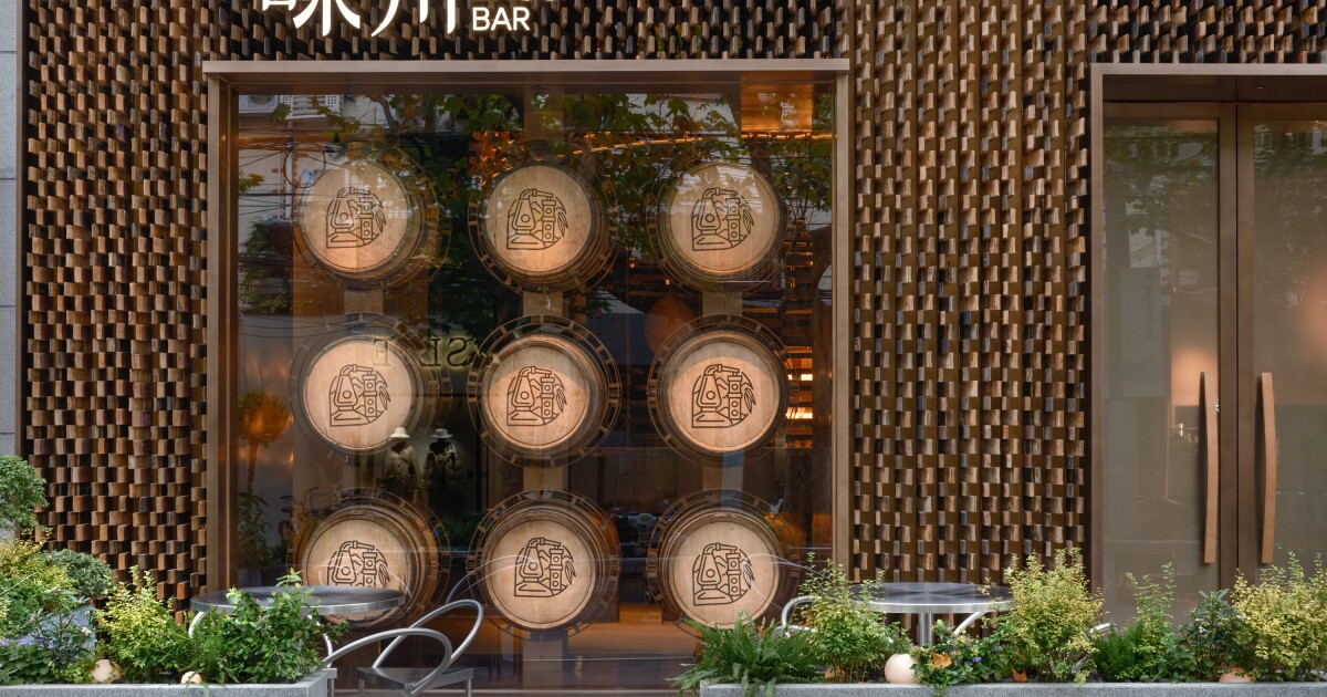 Discarded whiskey barrels used to form stunning one-of-a-kind bar