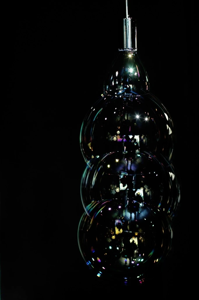 Instead of a lampshade, the Surface Tension Lamp continuously blows bubbles