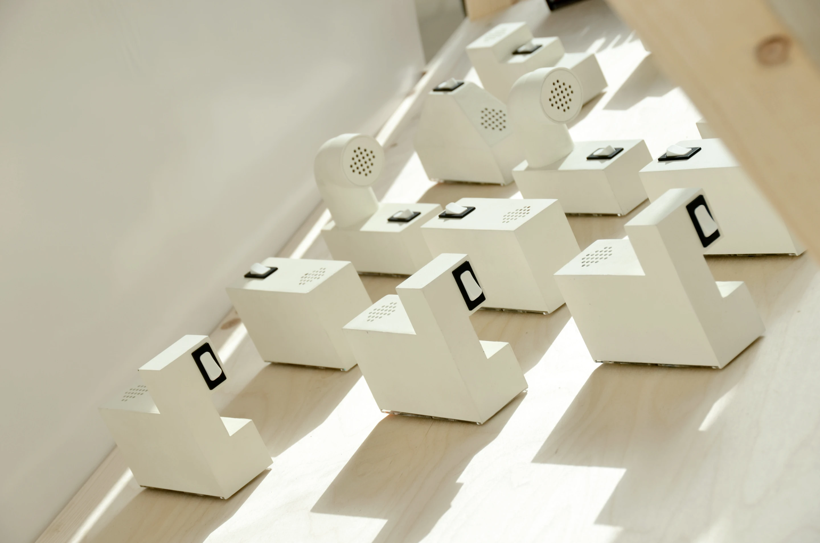 There are an array of robots that each emit a different sound while moving along the colored path