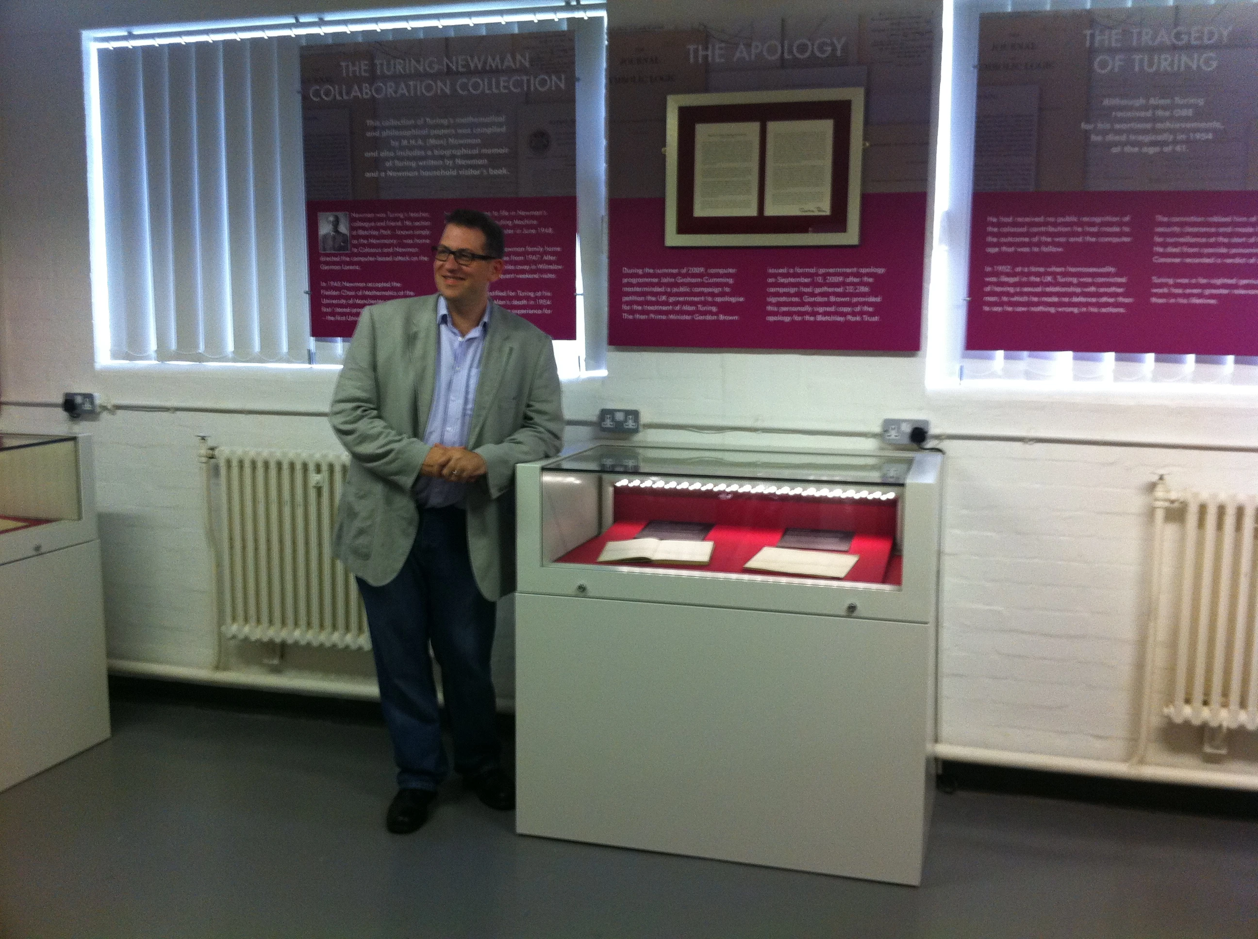 Developer Relations Manager at Google Simon Meacham had flown over from Mountain View to attend the garden party, and is shown here with the Turing papers he earlier helped secure for Bletchley Park