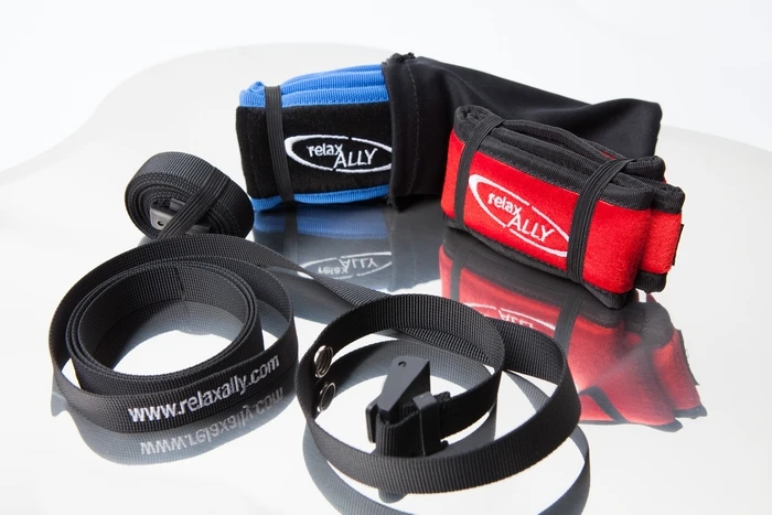 The Restband actually consists of two parts – a soft, adjustable headband that is worn by the user, and a cam-buckled strap that is placed around the top of their back rest