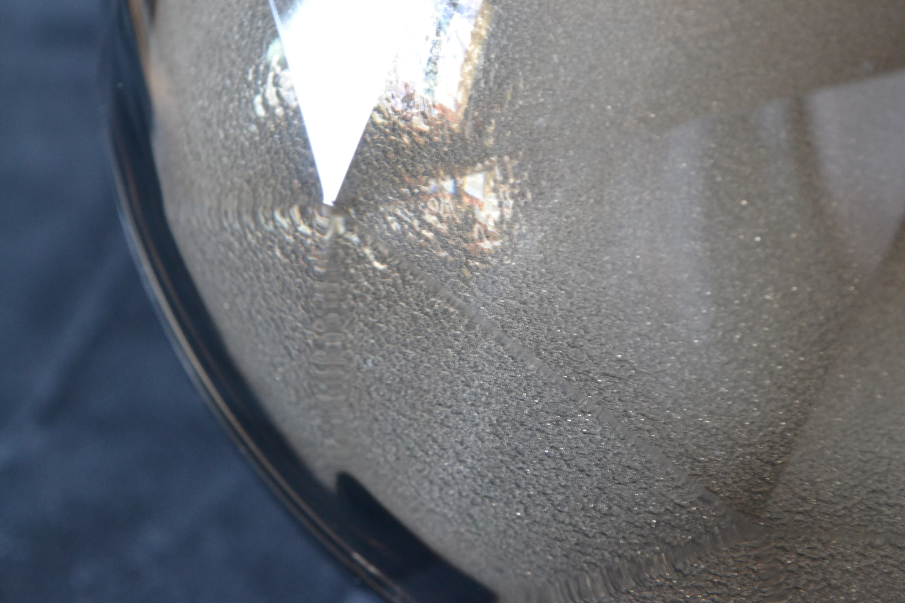 Beneath the smoked transparent face is a glittering light diffuser dome covering seven sets of front-mounted LED lights and one more set at the back