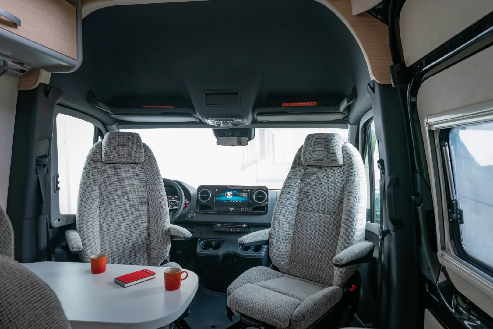 The swivel cab seats and dual-seat bench combine into a four-person dining area; with the optional pop-up roof, the van can sleep four as well