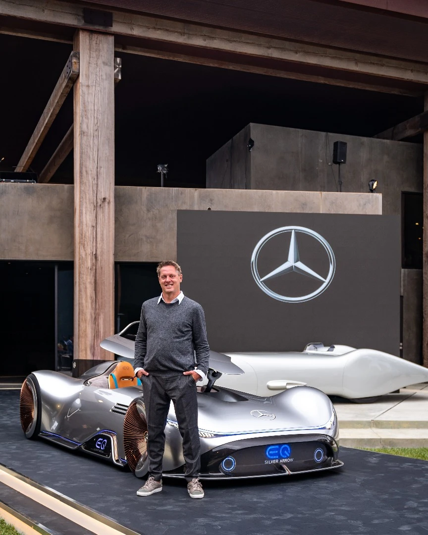 Gorden Wagener, Chief Design Officer at Daimler AG, stands rather proudly in front of the Vision EQ Silver Arrow concept at Monterey Car Week