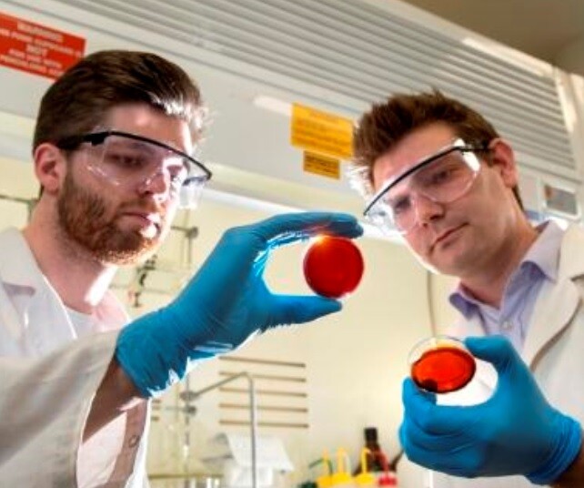 Flinders University student Max Worthington with Doctor Justin Chalker and samples of the new sulfur-limonene polymer