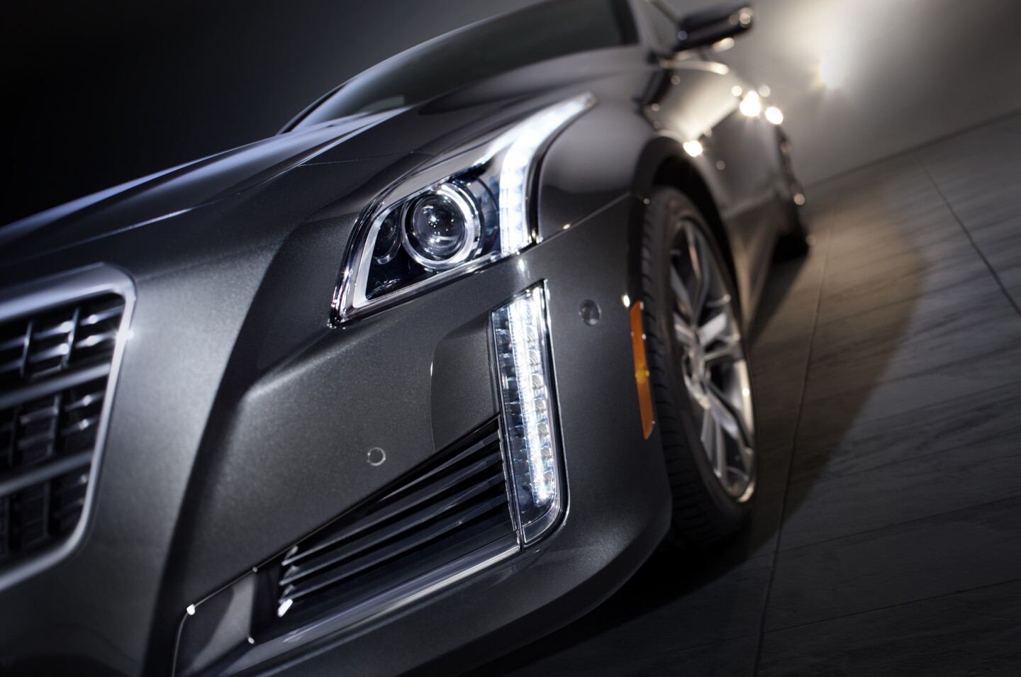 Cadillac’s shield grille and lighting are revised for 2014 while the grille is wider, with a more detailed texture