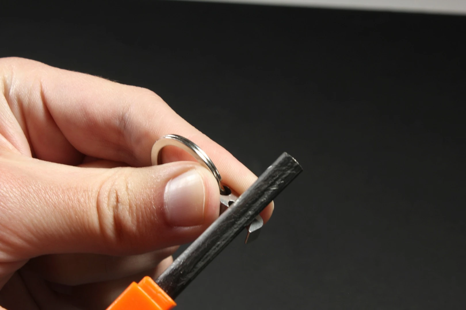The Claw multitool measures just 0.7 inches long and can be used as a flint striker