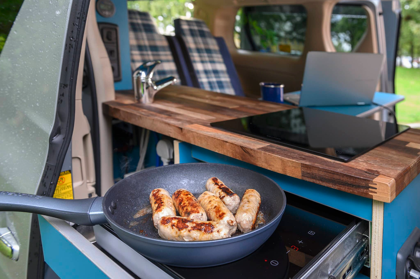 The Eco Pioneer II has two individual induction cookers, easily accessed from inside or out