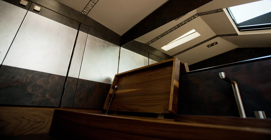 Below deck features storage space and a wooden work bench