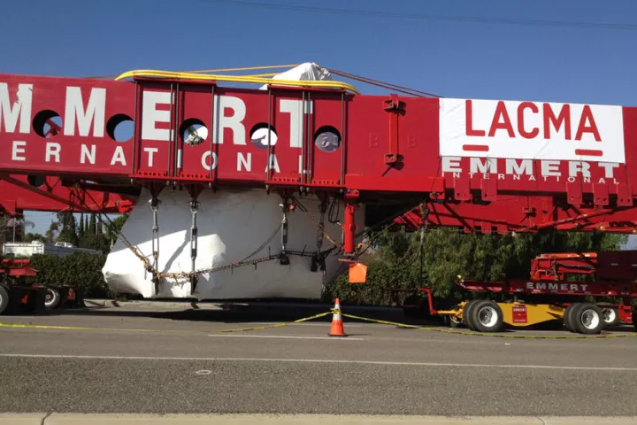 A specially-designed truck is carrying the massive 340-ton rock to Los Angeles at 8mph