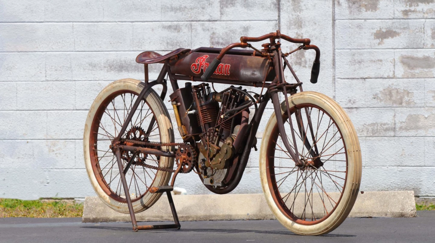This 1914 Indian 8-valve Racer is a perfect example of Indian's production racer of the period which was fearsome fast. The 8-valve was a dominant force on the board tracks of the period, and one was timed at 114.17 mph in 1920. That's a 1000cc v-twin engine with four valves per cylinder. This lot was sold "as raced" and retained it what is estimated to be 70 percent of its original paint. In perfect running condition. Auction Description