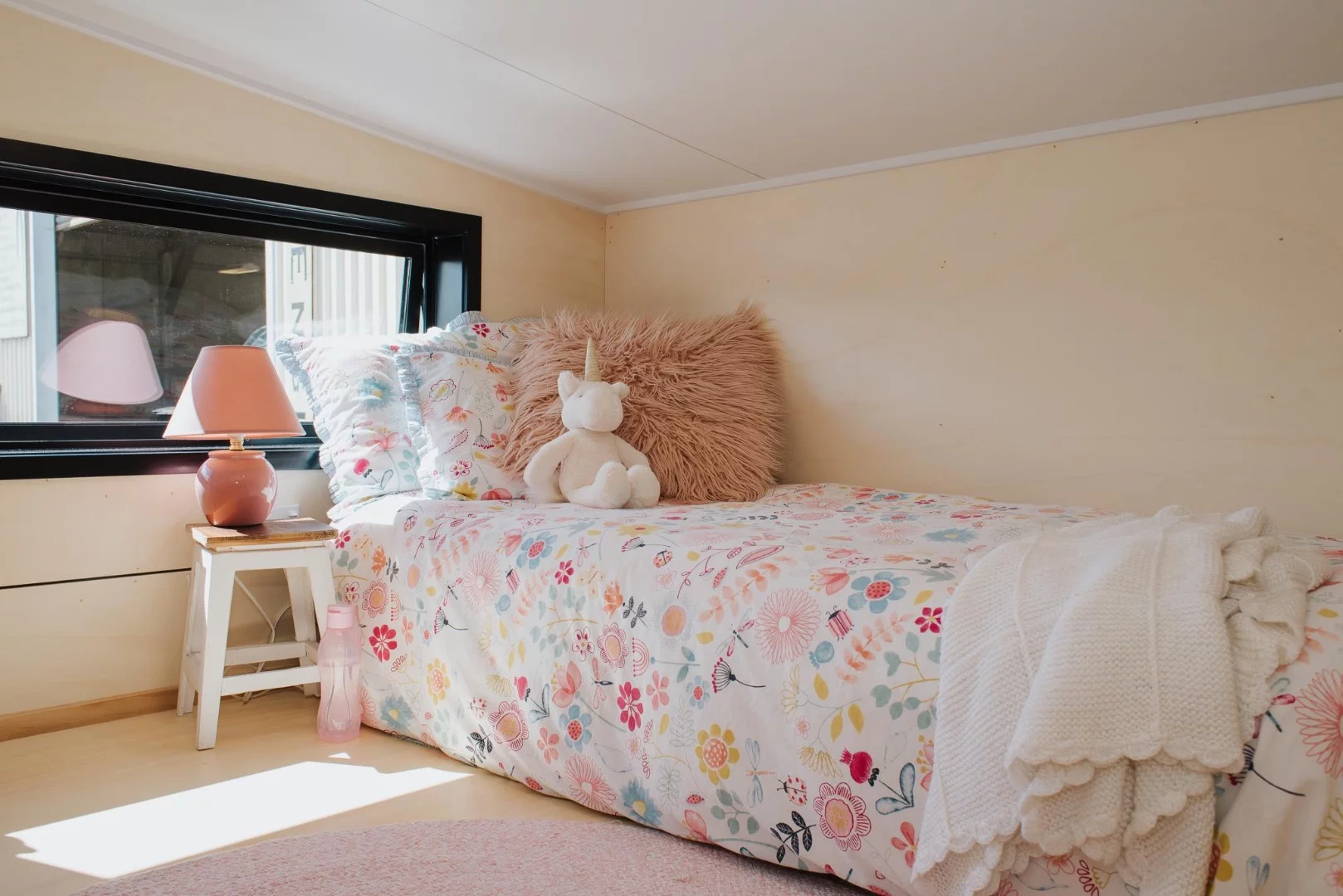 Another shot of La Sombra Tiny House's secondary bedroom. There's only one bed pictured but it's usually home to three children