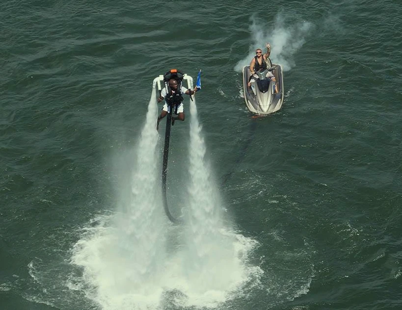 The rider stays within 40 feet of the craft below