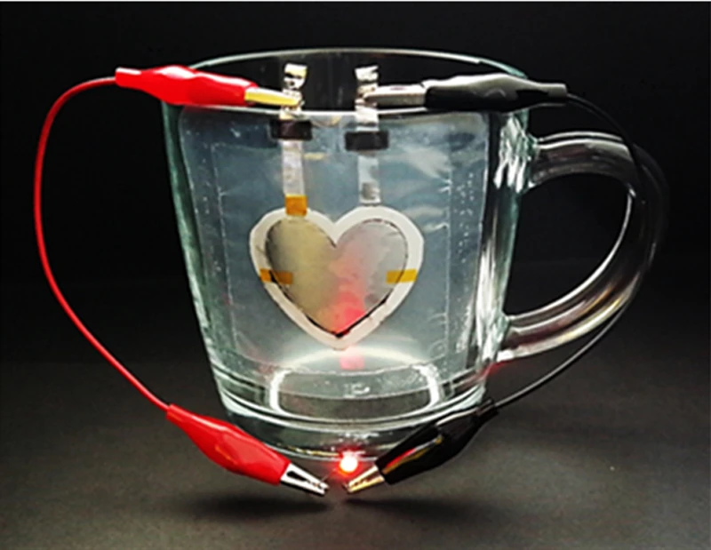 The heart-shaped battery printed onto a glass cup is capable of powering an LED