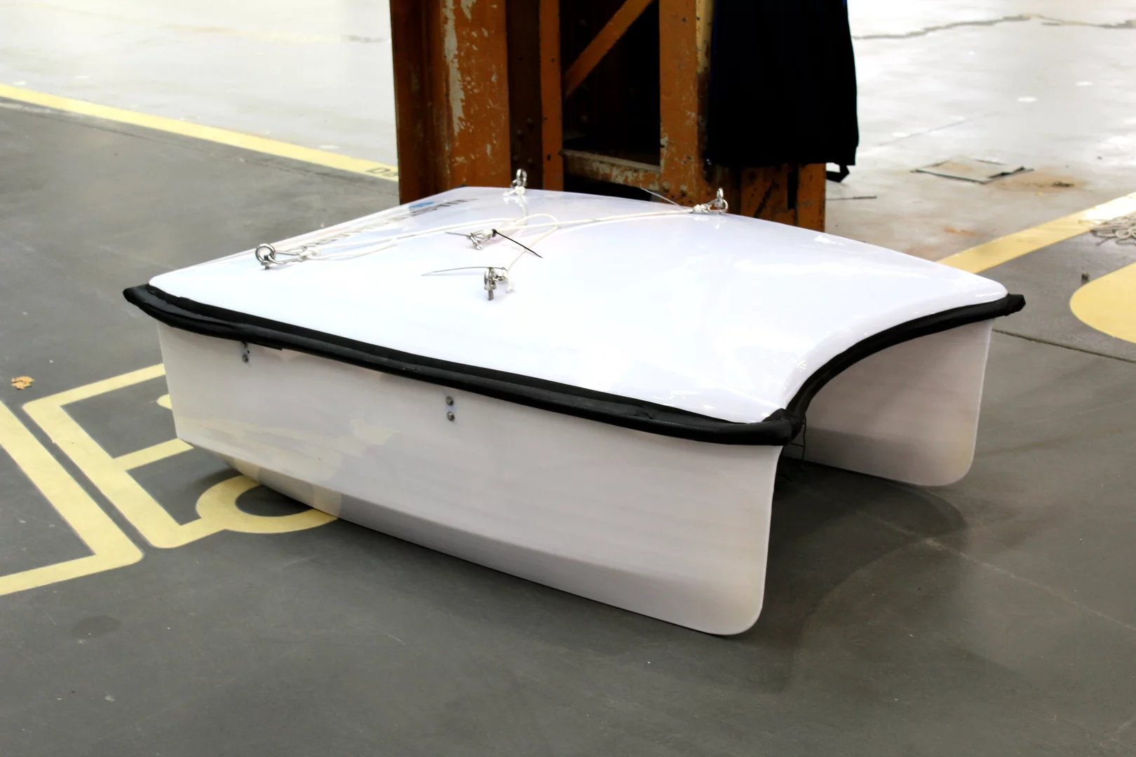 The WasteShark takes the form of a small electric catamaran with a scoop (or "mouth," if you will) located between the pontoons