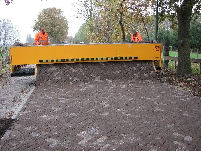 The Tiger Stone laying a brick road