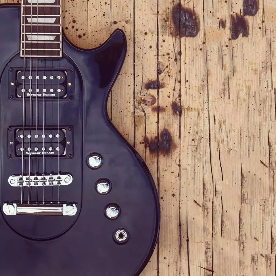 A black Pol core, with twin humbuckers, married to a black Les Paul outer body shape