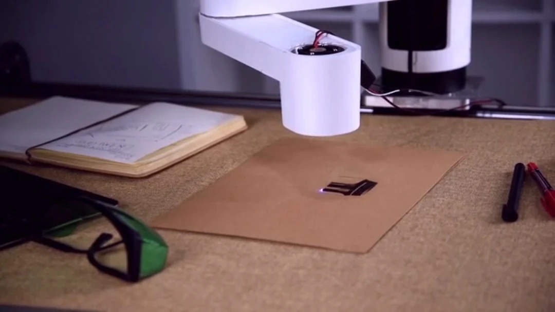 A laser engraver tool head allows the Dobot M1 to engrave images, text and photos from the Dobot software