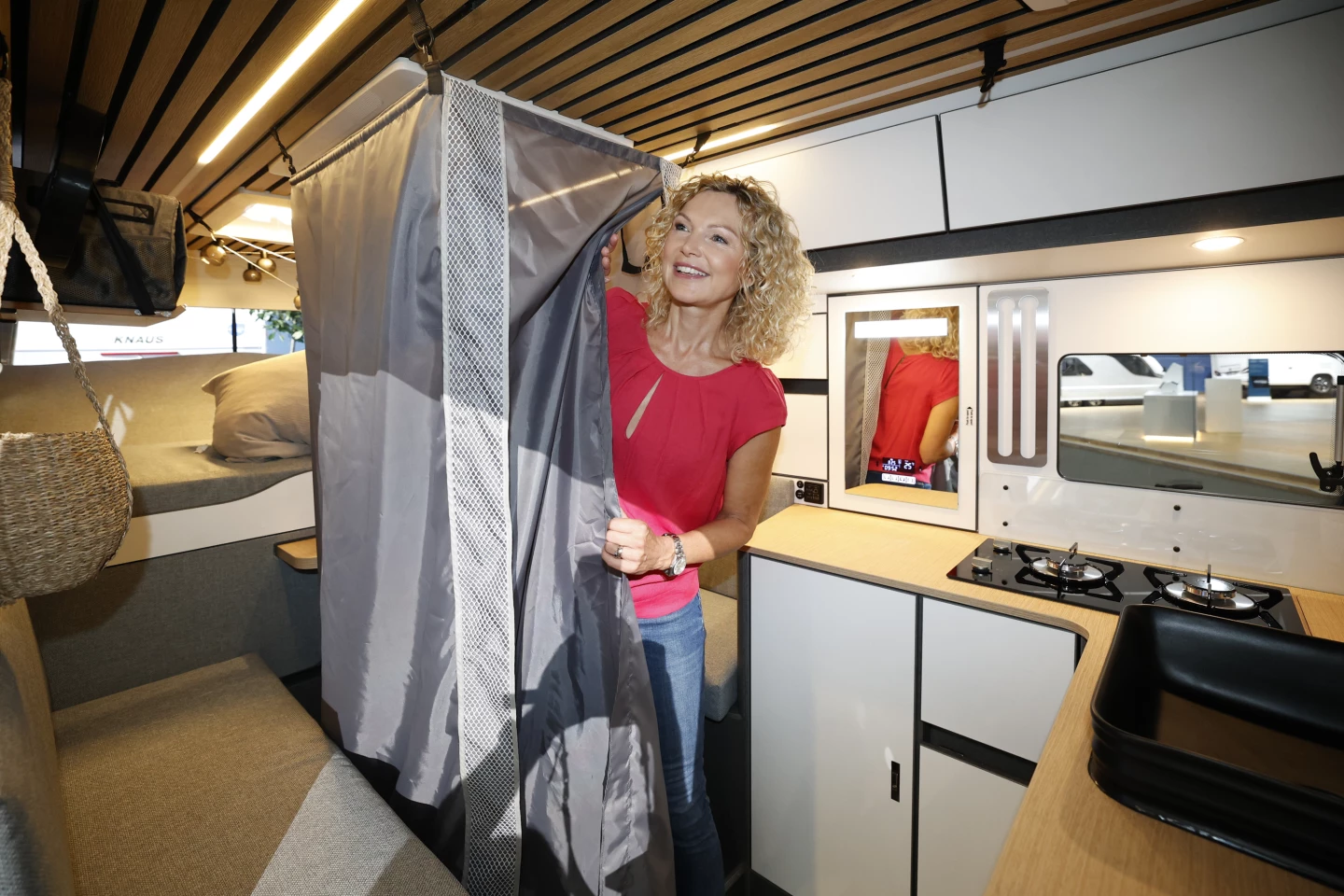 The "Secret Shower" stores away in a compartment below the slide-out dining table, quickly deploying for a morning or evening scrub