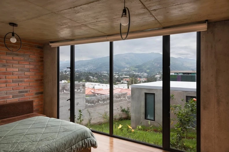 The second volume of the home features the master bedroom with private bathroom
