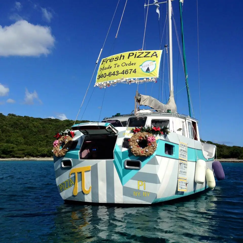 Sasha and Tara Bouis have transformed an abandoned aluminum sailboat into a floating pizza shop