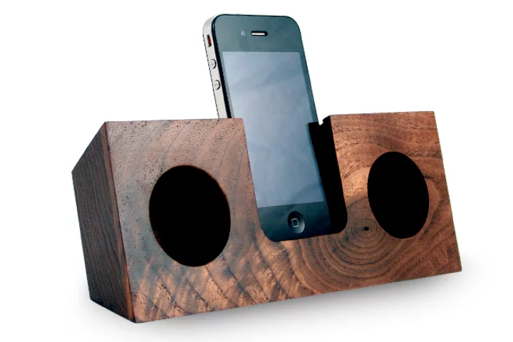 The Koostik iPhone dock utilizes the smartphone's own speakers, and channels the audio into hollowed out, hemispherical sound chambers where the sound is amplified by up to four times
