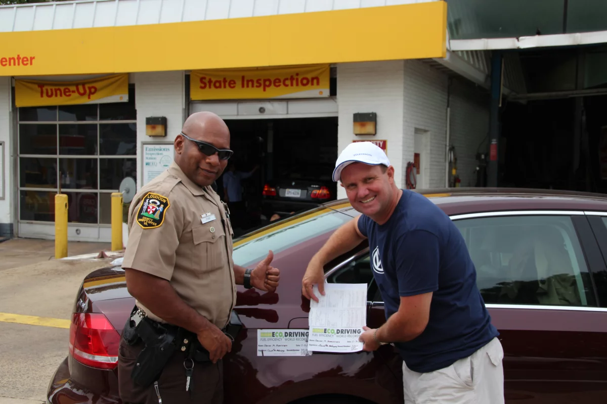 A Loudoun County, Virginia Sheriff’s Deputy verifies the car’s mileage before removing the fuel tank seal