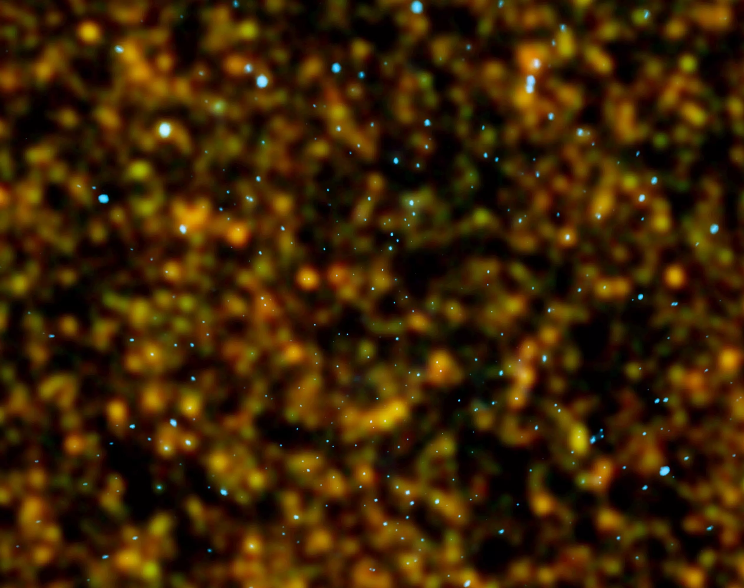 A composite X-ray/submillimeter image of the Chandra Deep Field North (Image: ESA/Herschel/HerMES; NASA/CSX)