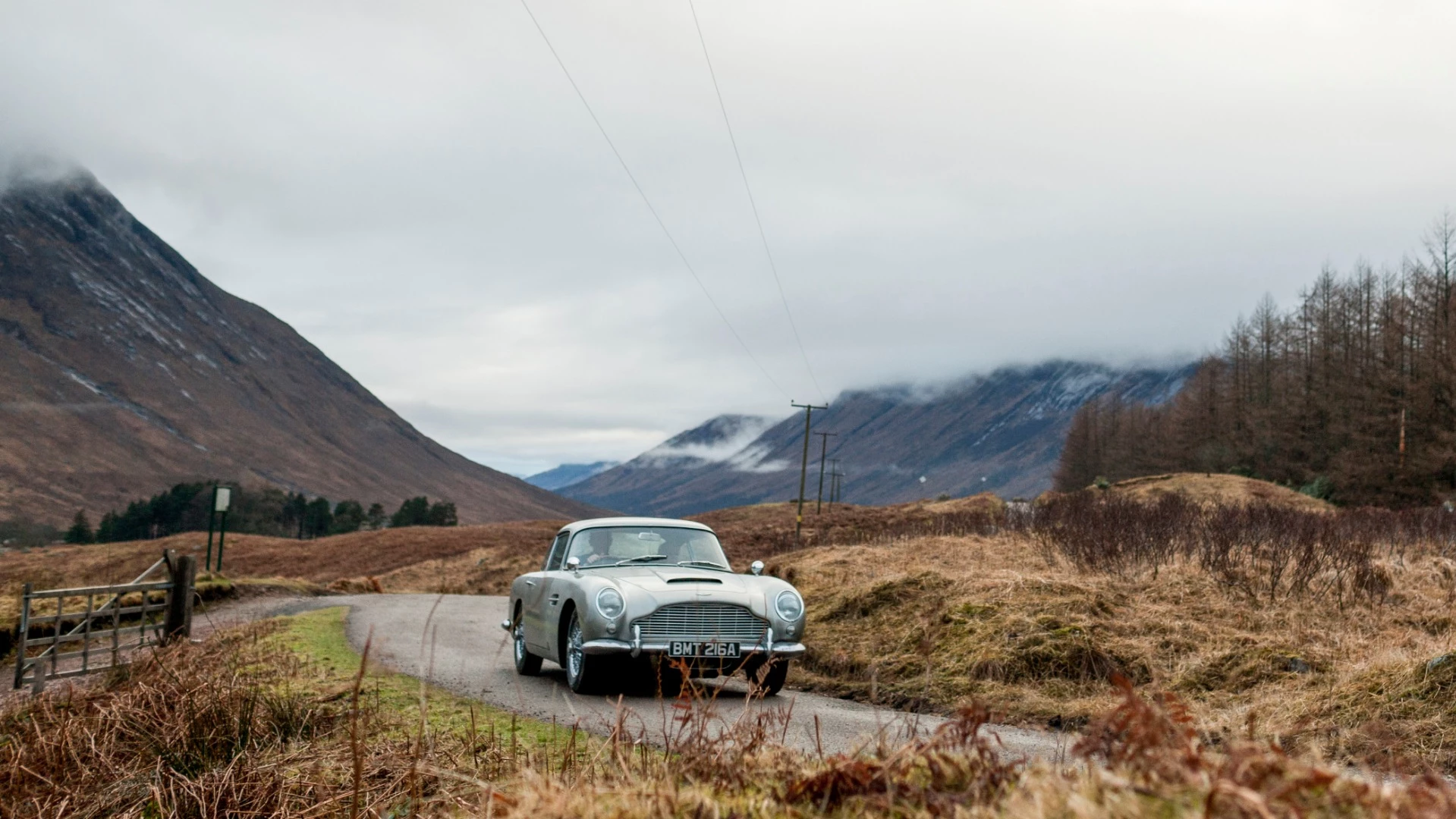 Sean Connery and the famous "Birch Silver" Aston Martin DB5 during the filming of "Goldfinger"