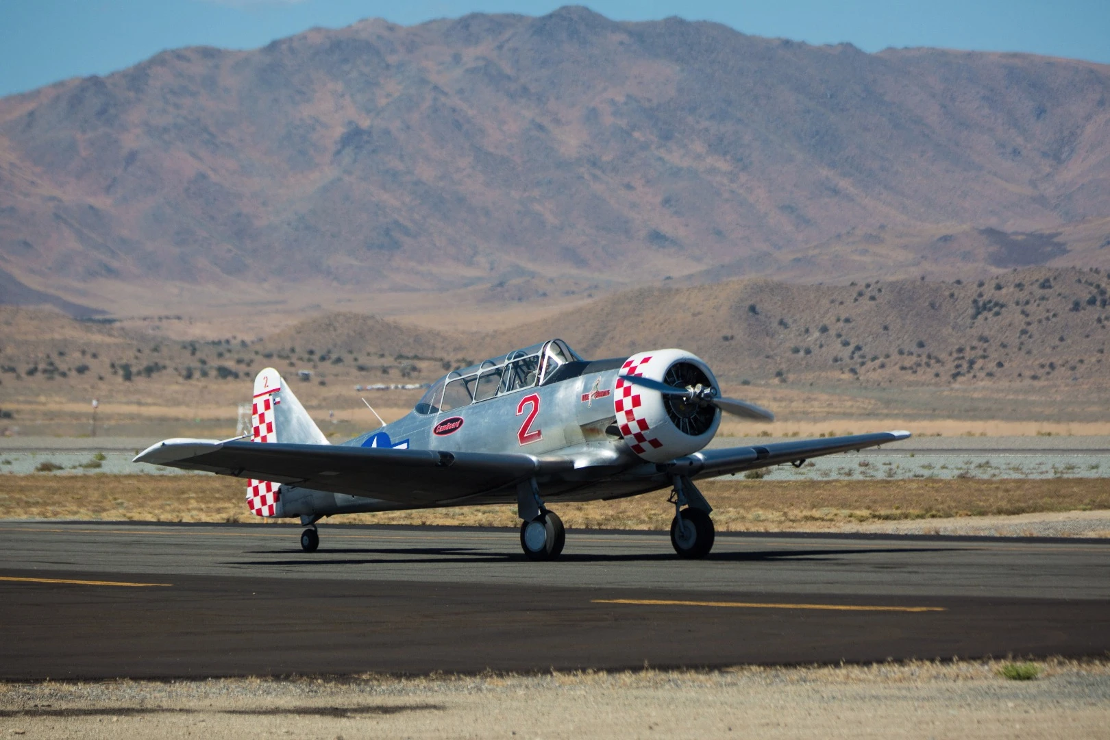Bare Essentials, a Harvard Mk IV T-6 plane, taxis toward the runway