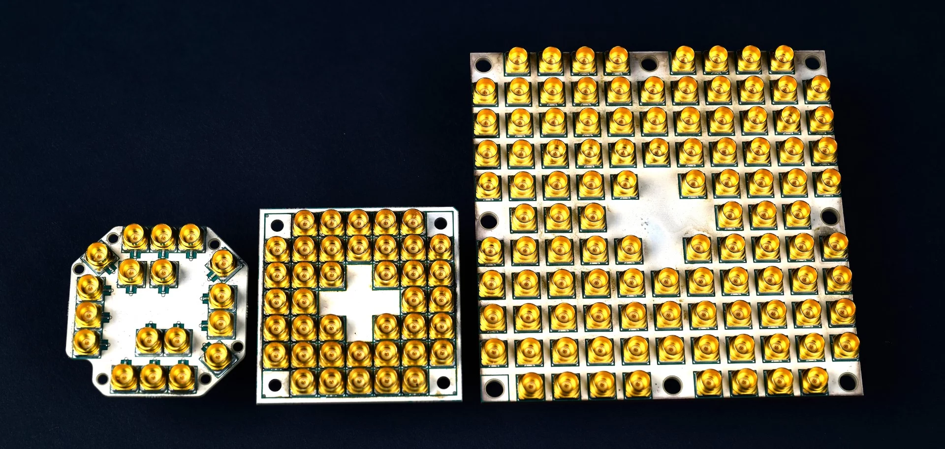 The progression of Intel's quantum computing chips, from left: 7 qubits, 17 qubits, and the latest with 49 qubits