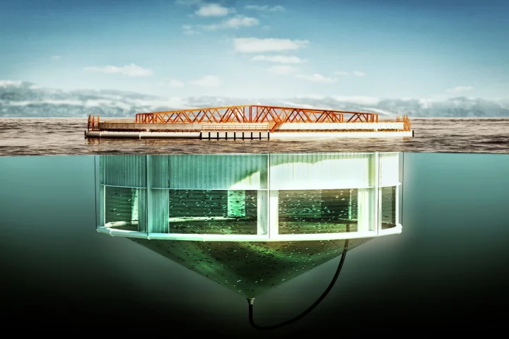 The walls of the Aquatraz salmon pen are composed of exposed netting at lower depths, but are protected by a steel skirt at the top