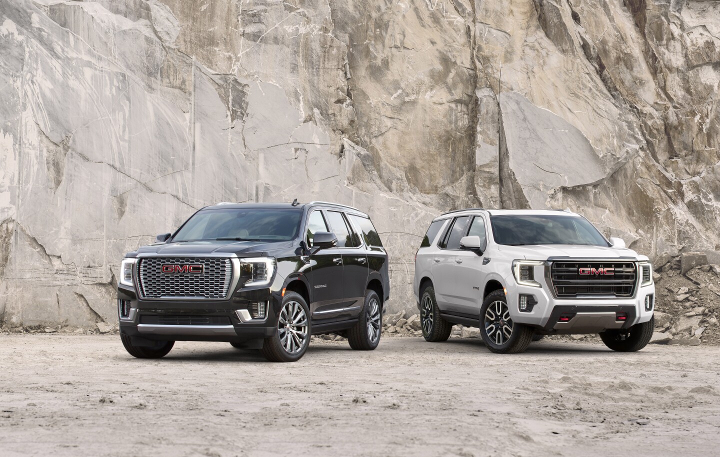 More details on the 2021 GMC Yukon will be made available closer to its production (Denali shown at left, AT4 at right)