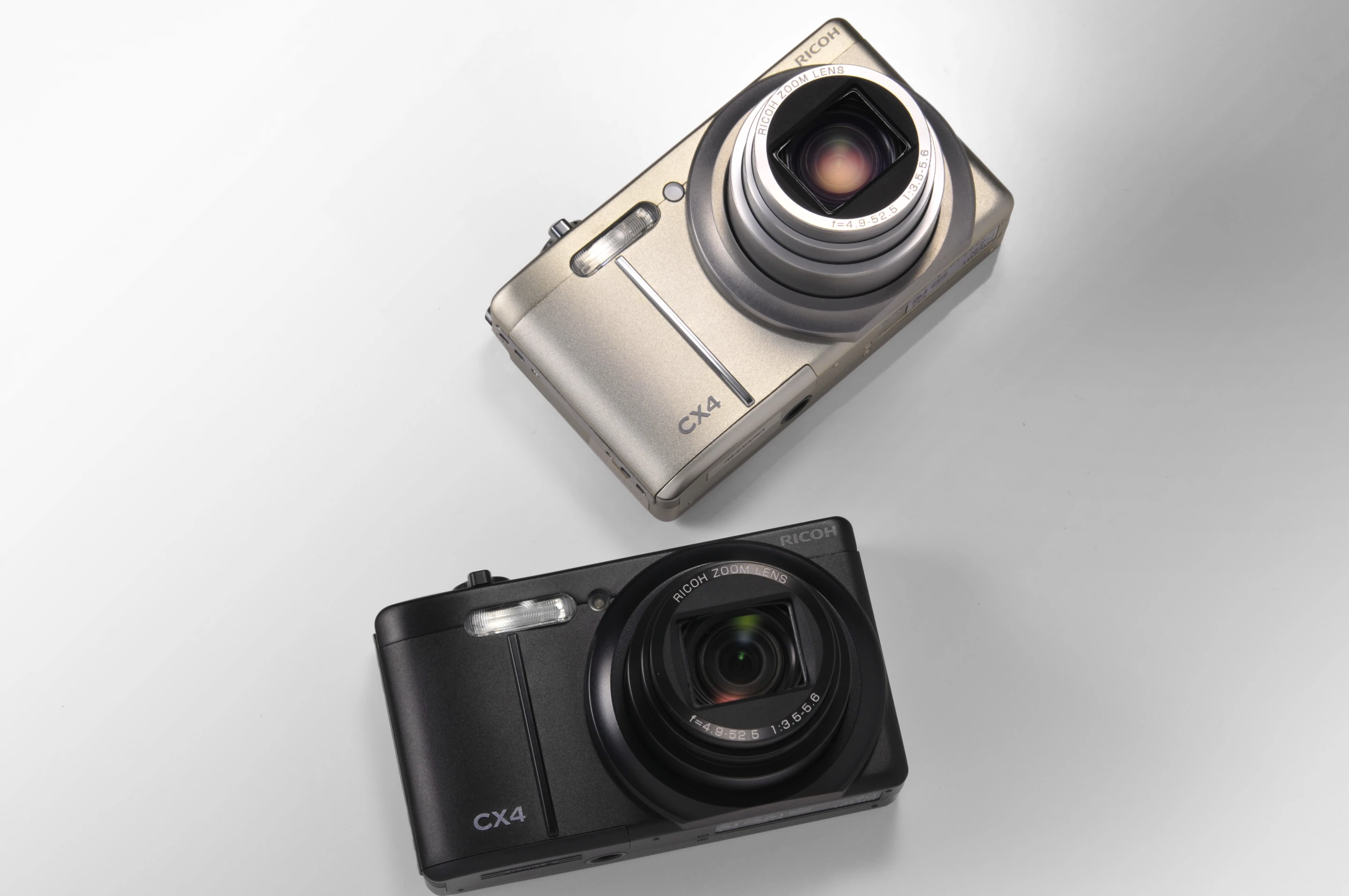 The CX4 in black and silver, from the front with the lens open