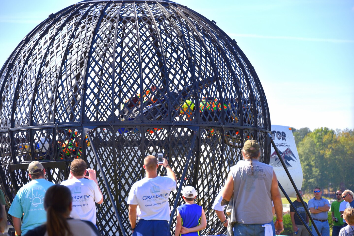 That's the "Globe of Death". Three riders traveling up to 60mph in a small sphere.