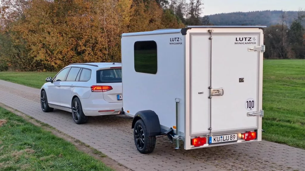 Aside from the writing, the Lutz Minicamper looks like a basic moving or cargo-hauling trailer, providing a stealthy way to explore the country