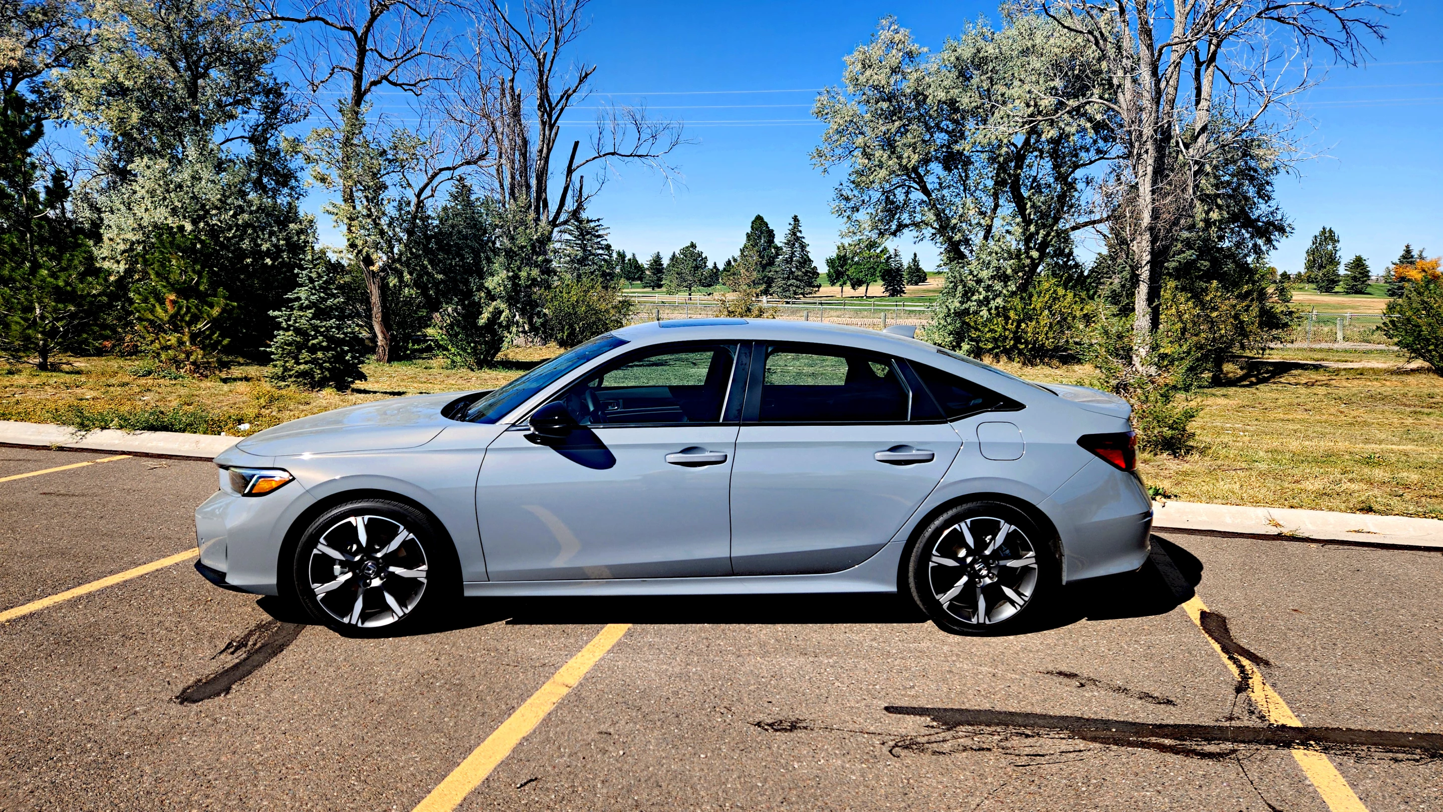 The 2025 Honda Civic Hybrid comes in both sedan (shown) and hatchback models in two trim levels