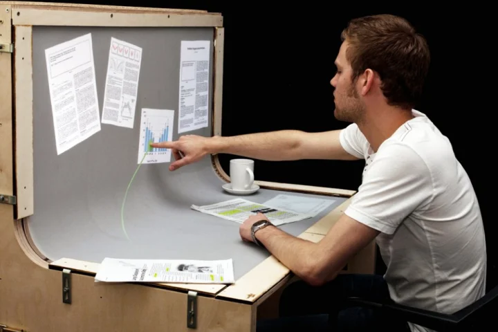 BendDesk renders the horizontal desktop and vertical display screen into one multi-touch surface via a curve in the middle