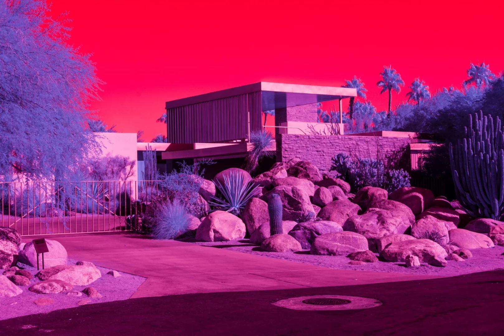 Kate Ballis’ series Infra Realism is an extreme, stylized take on the style contrasting images of classic mid-century Palm Springs architecture with jarringly sharp and disorientating infrared purples and reds