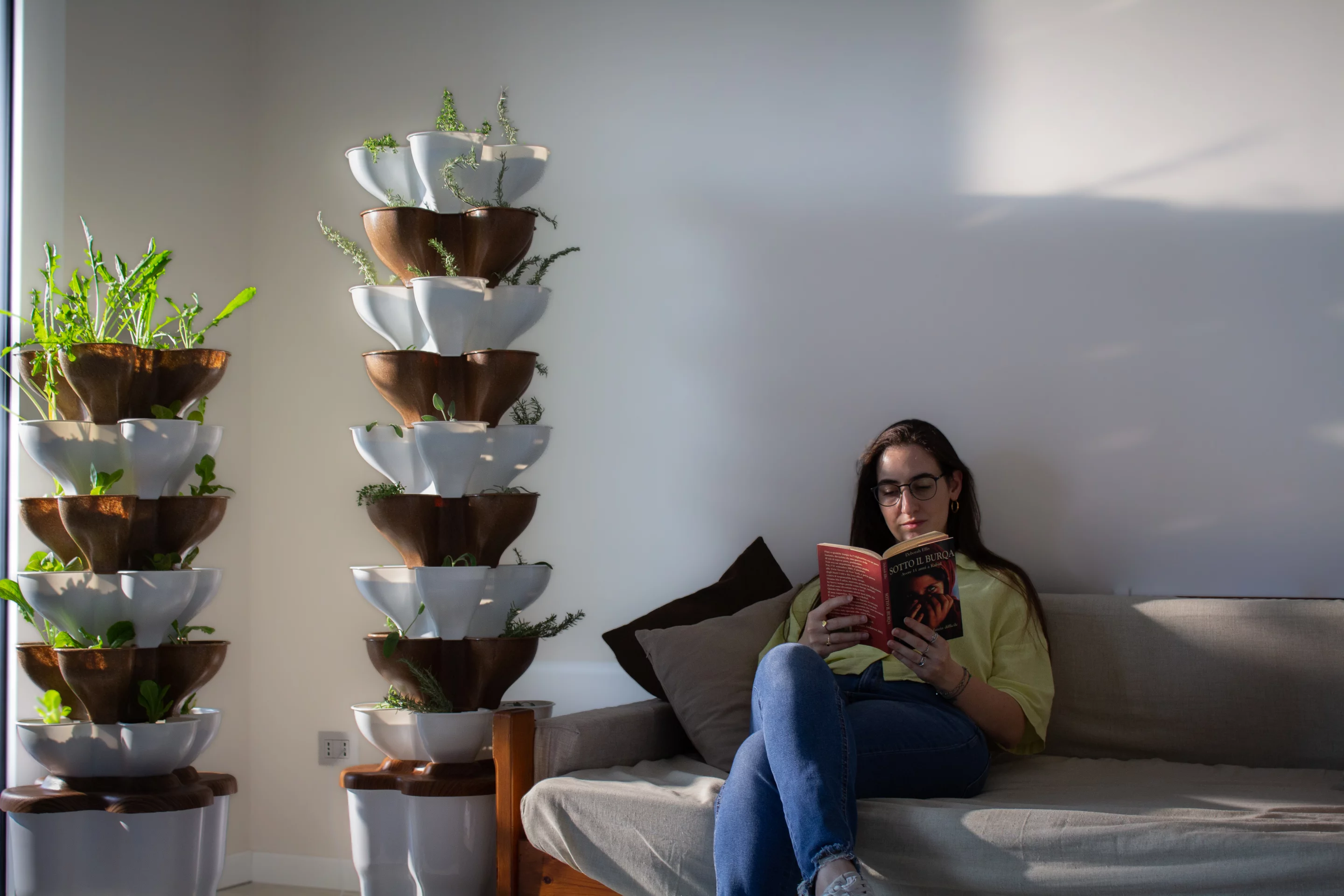 A Clovy grower hard at work cultivating the plants in the vertical garden