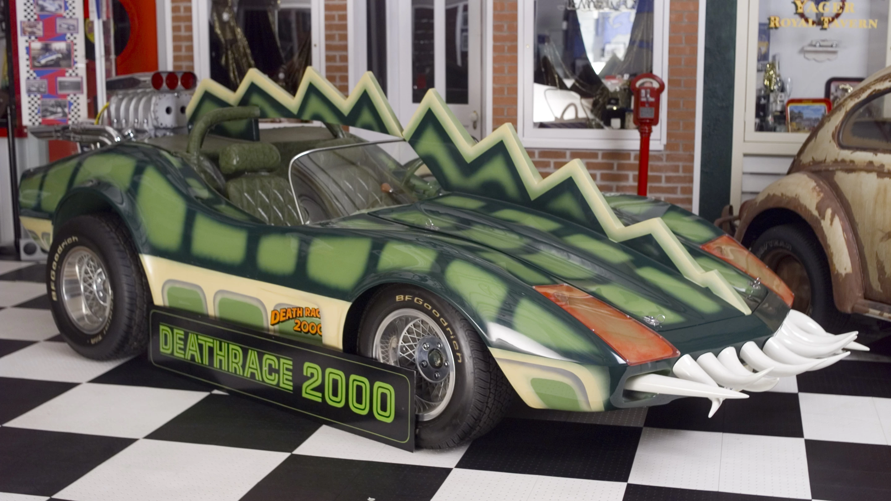 The car that is coming to auction is the Alligator Corvette driven by Carradine in Death Race 2000 (1975). The one-of-a-kind “alligator” Corvette (it's actually a Volkswagen chassis with an air-cooled Corvair motor), is expected to fetch between $20,000 and $25,000, despite the fact it got lots of screen time as Carradine (Frankenstein) fights against his deadly rival Stallone (Machine Gun Joe).