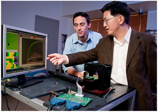 Stanford Professor Shan Wang and graduate student Richard Gaster, left, have developed an early-warning system for cancer (Images: L. A. Cicero)