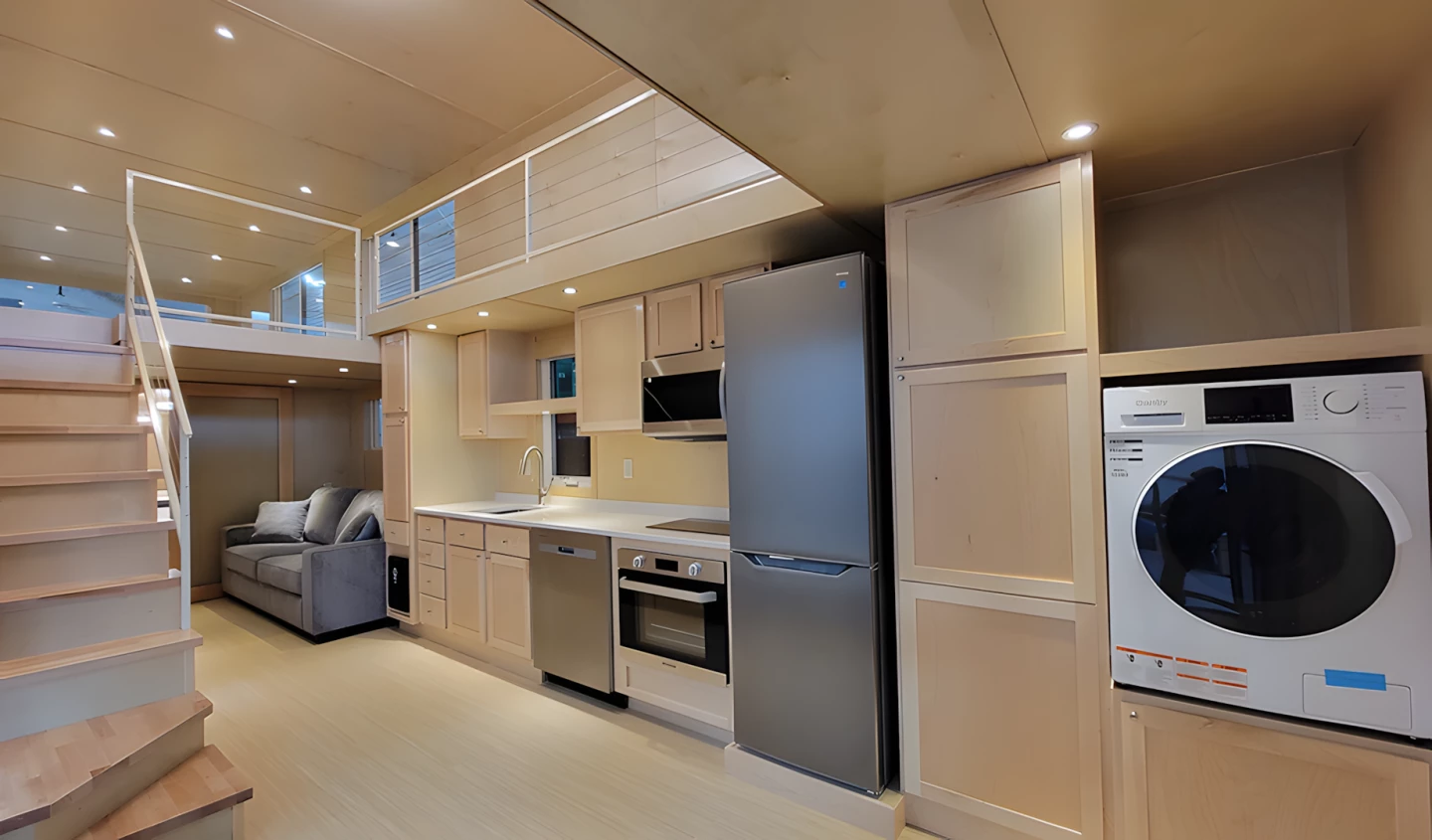 The Ultimate tiny house's kitchen is well-stocked and boasts a dishwasher, microwave, oven and an induction stove
