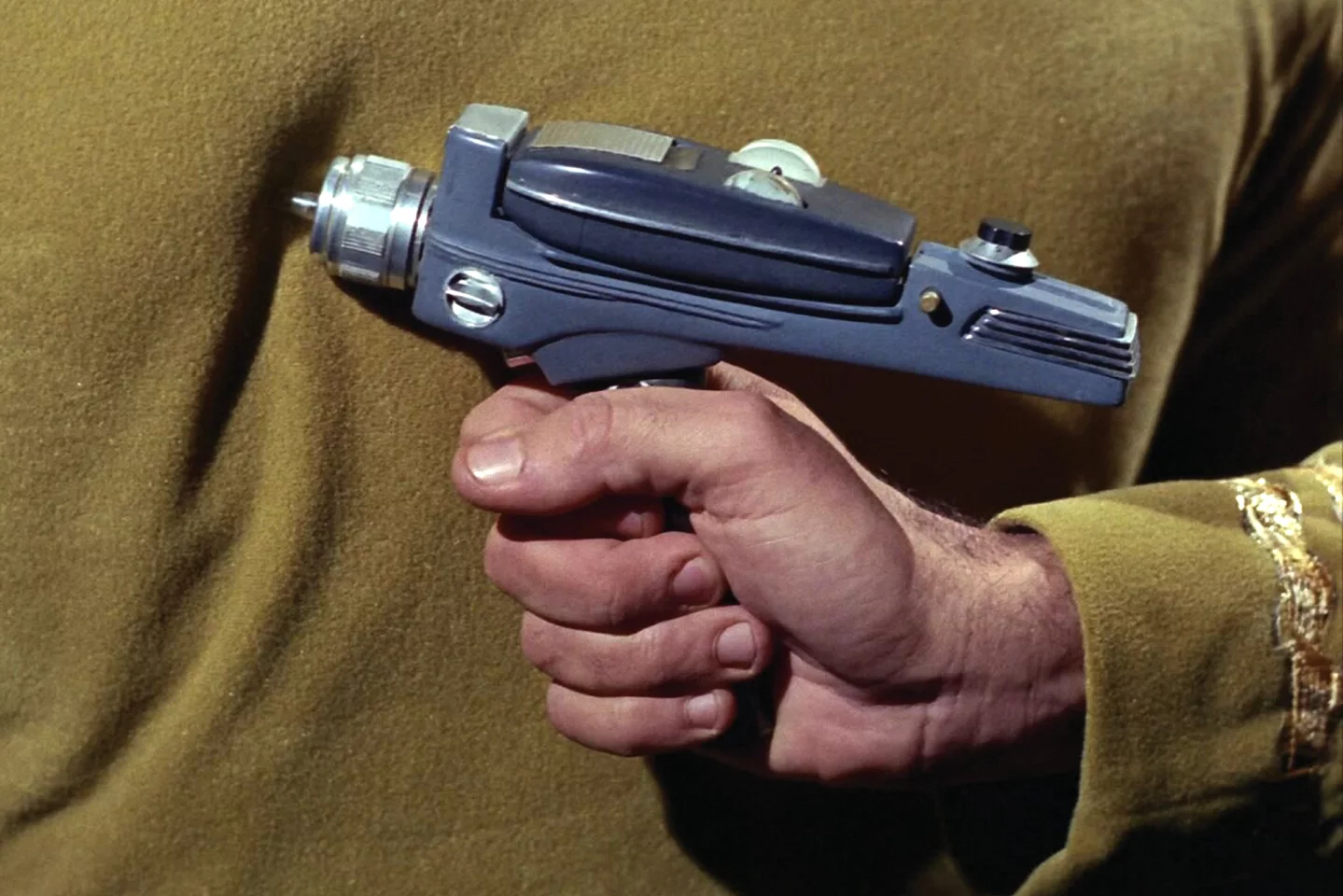 Though numerous Type-2 Phaser pistols were used during the filming of Star Trek, Captain James T. Kirk's Type-2 phaser was the obvious pick of the litter, and when the "hero" item auctioned, it did not disappoint. The termed "hero" means much finer detail and higher build quality, as it was specifically used for close up camera shots (like this one). In the 1990s, Type-2 Phasers from the original series were regularly available at auction for between $2000 and $5000. The question exists though, as to whether an item such as this has a "use-by" date at auction. Auctions are very simple - the person who wants it most and has the resources, wins, and whether this item will mean as much 100 years from now is doubtful. When demand drops off in the simplistic supply/demand equation, the price falls.