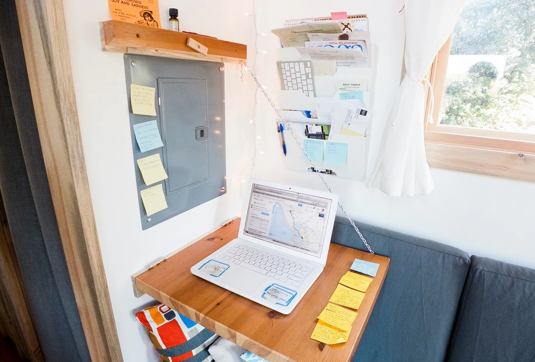 Space-saving furniture such as the foldable desk proves a fitting choice