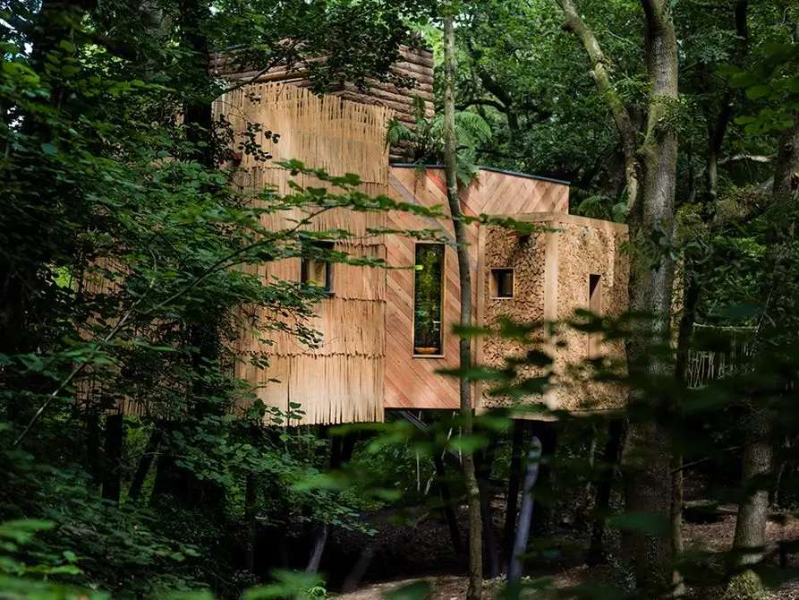 Boasting luxury features like a sauna and hot tub, the Woodsman's Treehouse also has a fun slide for those who want to make a quick exit